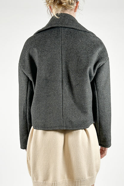 Double-breasted jacket in woolen cloth with raw cut edges