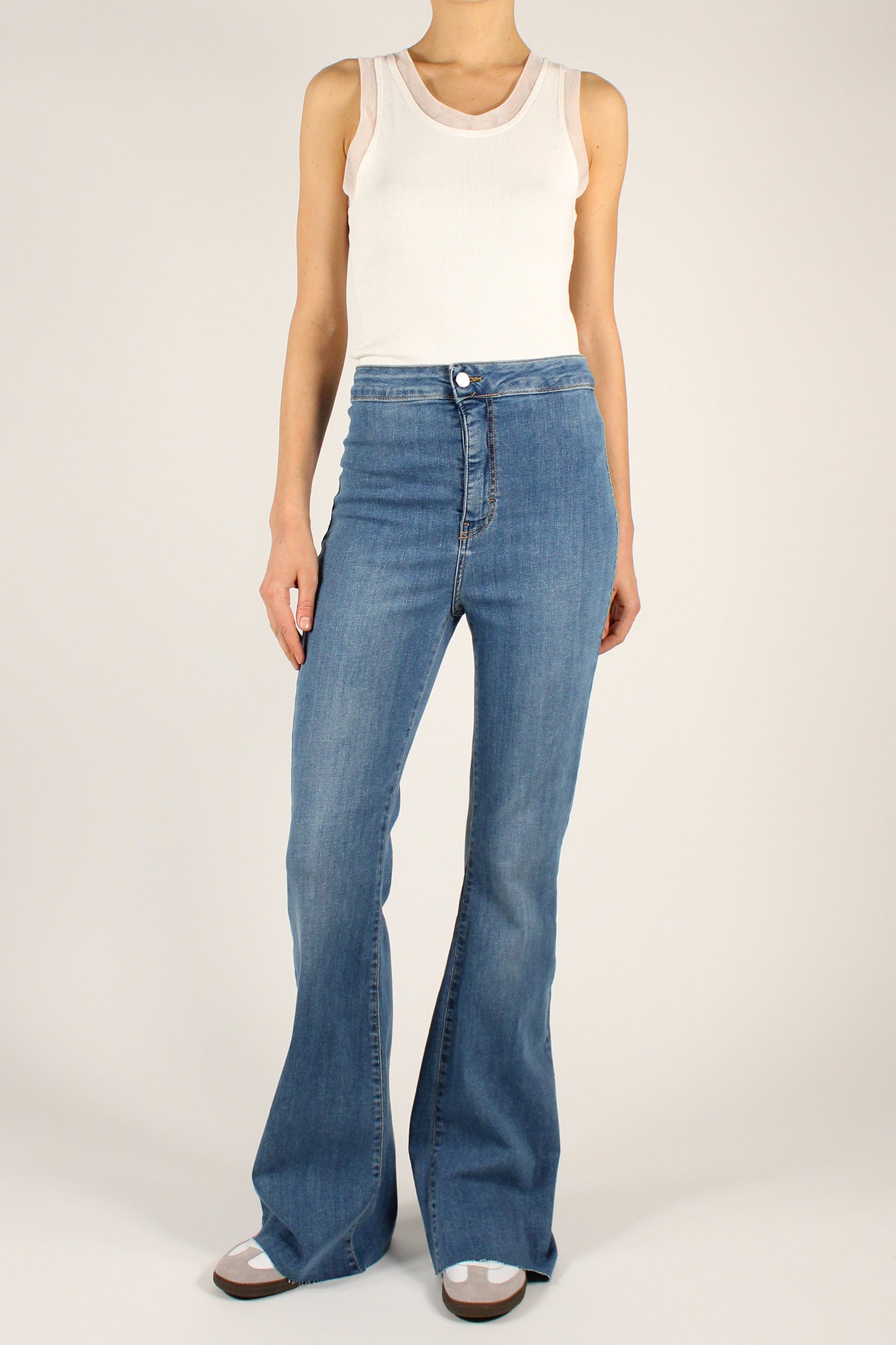 High-waisted flared jeans with raw cut bottoms